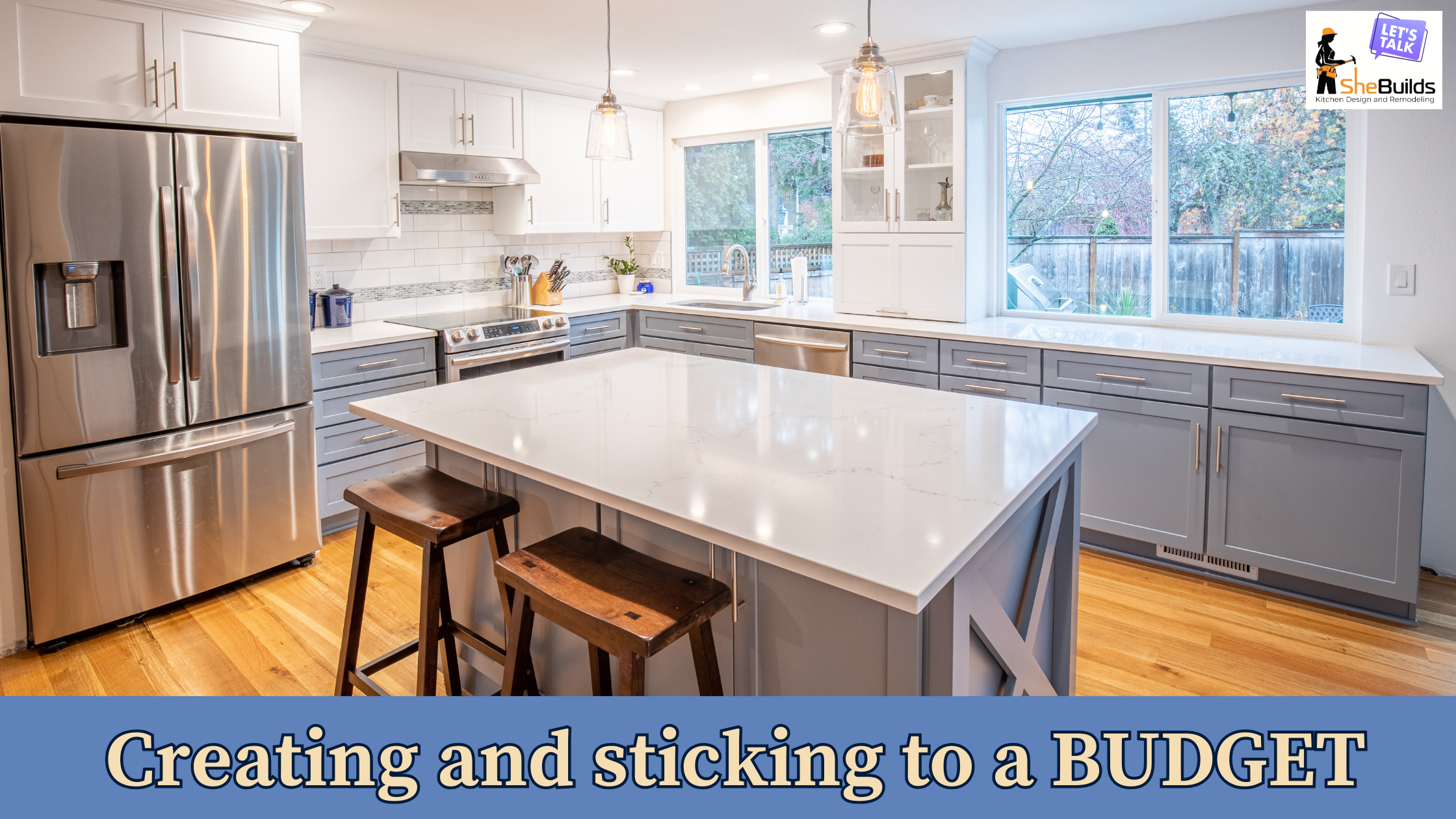 Bright white kitchen remodel with large island, quartz countertops, gray shaker cabinets, stainless steel appliances, pendant lighting, and natural wood flooring designed for a functional, budget-conscious renovation