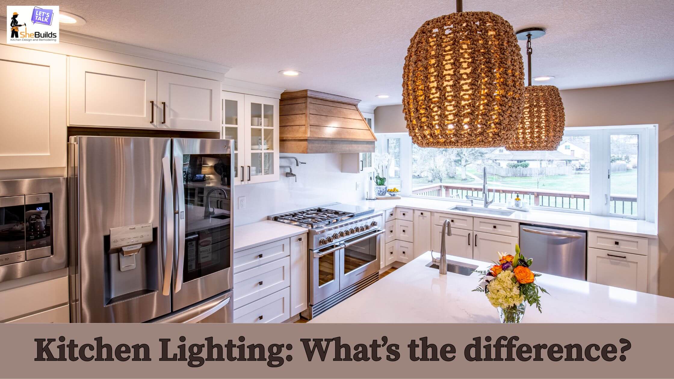 Bright white kitchen with shaker-style cabinetry, stainless steel appliances, a custom wood range hood, and woven pendant lights above a large quartz island. Large windows bring in natural light, creating a warm and inviting kitchen design. Banner text reads, "Kitchen Lighting: What's the Difference?" with SheBuilds Kitchens branding in the corner.
